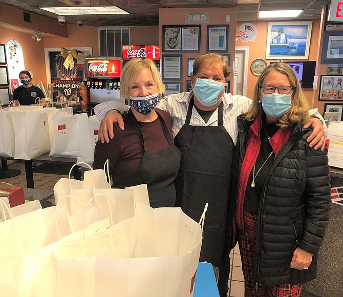 Skorpios Maggio's Greek Family Restaurant owners Chris and Sherry Maggio; Jayne Young, Interim Executive Director, Shepherd's Center.