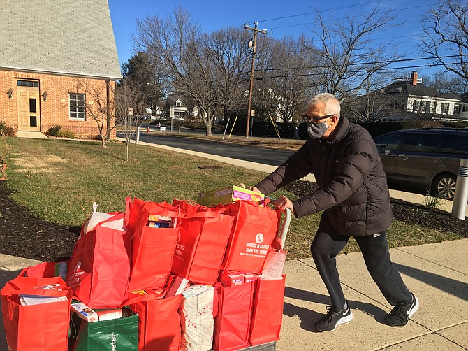 Frank Wagner, a volunteer from Reston, braved the cold to collect donations that will later be packaged and distributed to middle and high school students in Herndon.  Other collection sites in Fairfax and Loudoun counties were also busy, as Food For Neighbors received more than 18,000 pounds of food to support students in 22 schools.