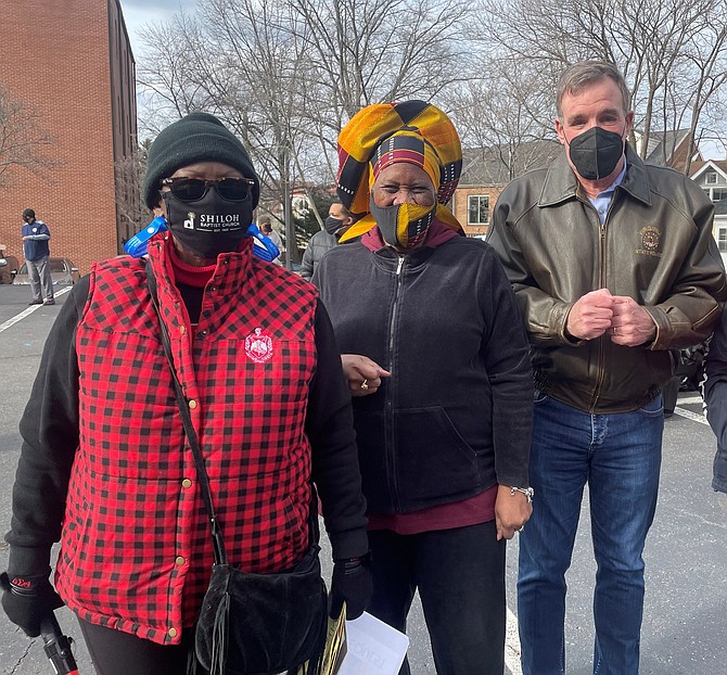 U.S. Sen. Mark Warner, right, is joined by Shiloh Baptist Church Associate Pastor Octavia Caldwell, center, and volunteer Marilyn Patterson at the church’s food drive in honor of the Martin Luther King Jr. day of service on Jan. 18.