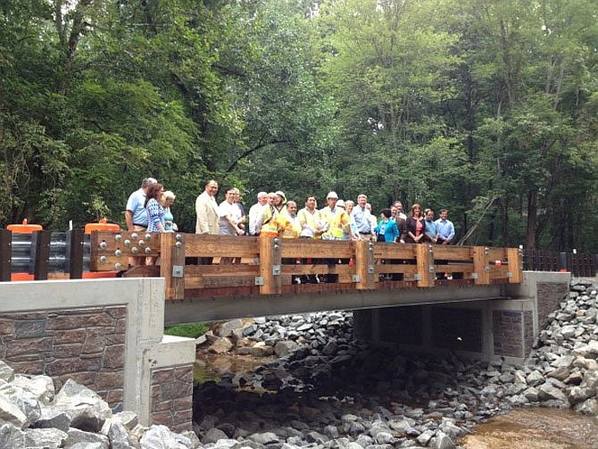 It could be déjà vu back to 2013 for the Springvale Road Bridge. Then, neighbors, elected officials and VDOT staff stood on the new single-lane rural rustic Beach Mill Road Bridge over Nicholas Branch in Great Falls.