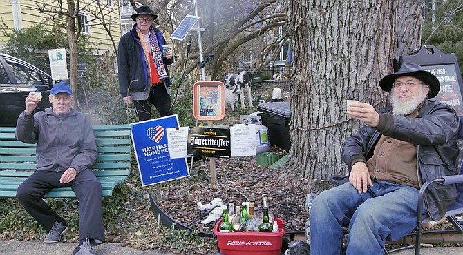 Scott Sklar (from right to left) with Jake McGuire and George McGlue in the afternoon outdoor Flamingo Club cocktail hour on Ivy Street.