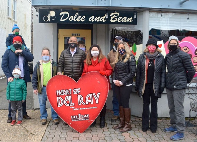 Dolce & Bean owner Petros Ghebre-Egziabher, center, was presented with the Heart of Del Ray award Feb. 12.