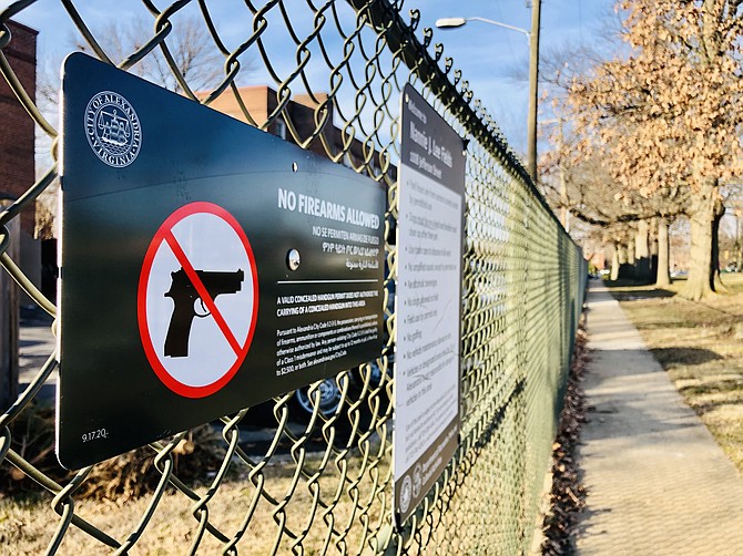 Signs like these went up across the city last year after the General Assembly gave local governments authority to regulate guns.