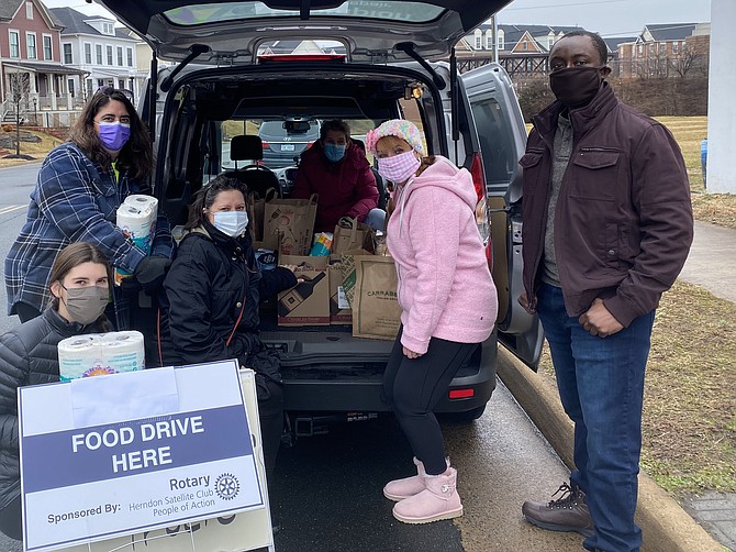 (From left) Garcia, Elysa Birman, Signe Friedrichs, Kimra Bonnet, and Eric Kemble at the Feb. 27 drop-off donation location outside ArtSpace Herndon to benefit LINK Against Hunger.