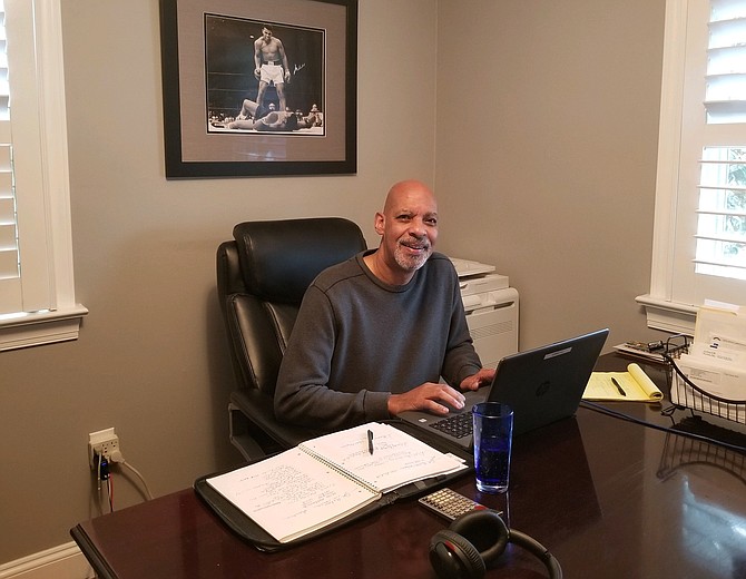 Cory Laws works from his home office during the pandemic.