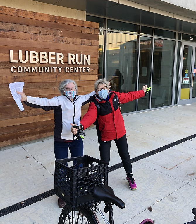 The reporter joins Karen Gerstbrein in jumping for joy after the jab at Lubber Run.