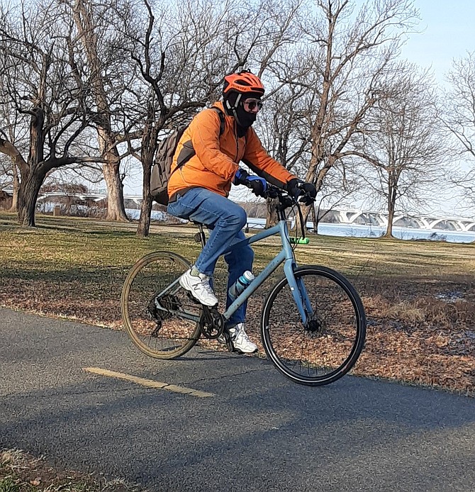 Even lone cyclists sported a mask.