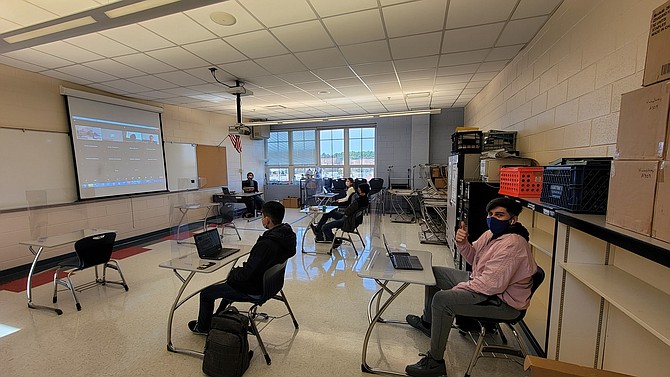 Students and staff are all smiles and thumbs up behind their masks as English language learners returned to ACPS' T.C. Williams International Academy on March 9, 2021. Students had lots of room to remain socially distant.