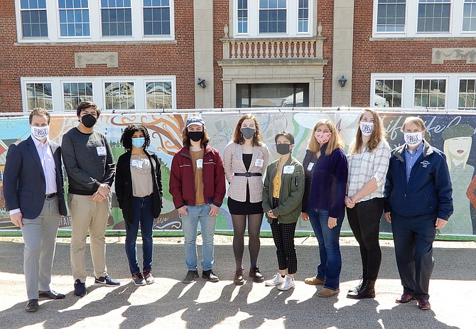 In front of the murals and the remainder of Paul VI High are (from left) Enrico Cecchi, Arian Assadzadeh, Rockett Beeson, Austin Eilbert, Sarah Bird, Sofia Mesa-Morales, Isabela Colon Matthews, PJ Naber and David Meyer. (Not pictured: Kaia Collins).