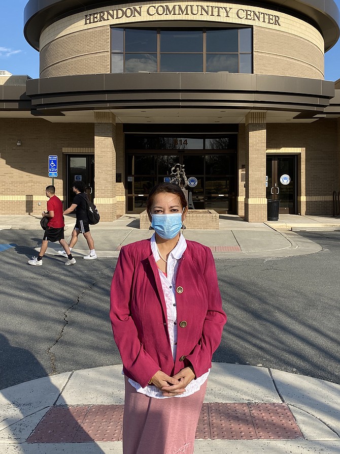 Herndon Town Councilmember Naila Alam stands outside the Herndon Community Center, where DMV Connect will offer limited services inside by appointment, March 22-25.
