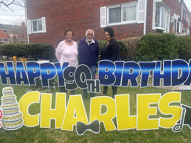 Charles Nelson, center, celebrates his 90th birthday March 11 at his home in Alexandria with daughter Gail Nelson and granddaughter Shaye Nelson.