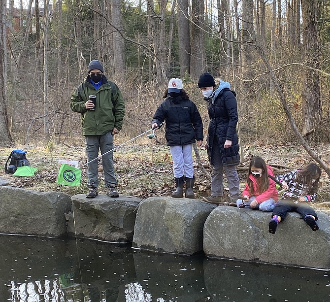 The Rodriguez family of Reston, (from left) Bernardo, Adrian, 10, Lysandra, Alicia, 7, and Anabel,4, at the Reston Association 2021 Kids’ Trout Fishing Day, Saturday, March 20.