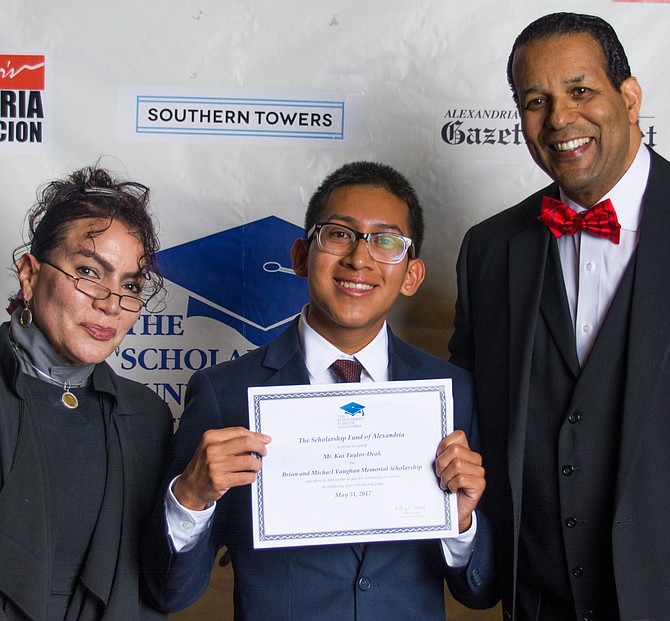 Darlene Casey and Dr. Michael Casey presenting a scholarship award to Kai Taylor-Deak.