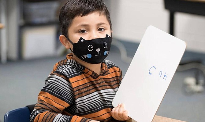 A young FCPS student is back in school for in-person learning.