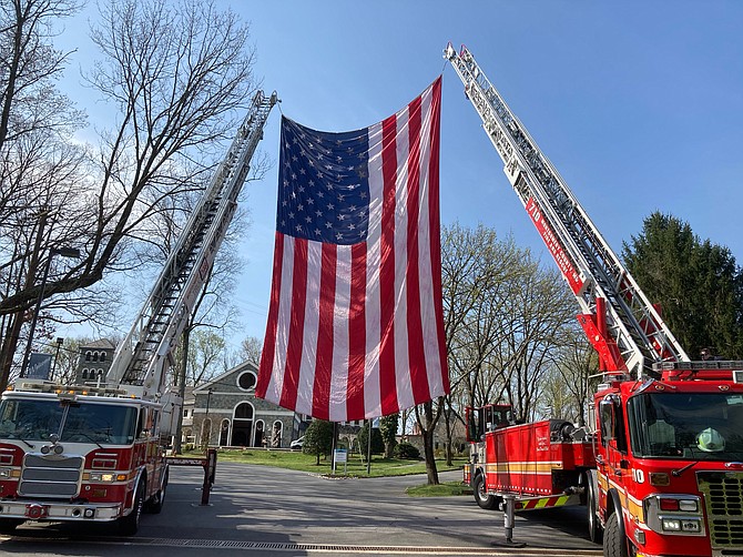 Fire and rescue personnel prepare to honor Cabin John Park Volunteer Fire Department’s Stephen Miller before the memorial celebration of his life at Our Lady of Mercy on Tuesday, April 6, 2021.