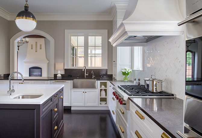 This kitchen, created by designers at Anthony Wilder Design/Build, features a Caesarstone island and Silestone perimeter.