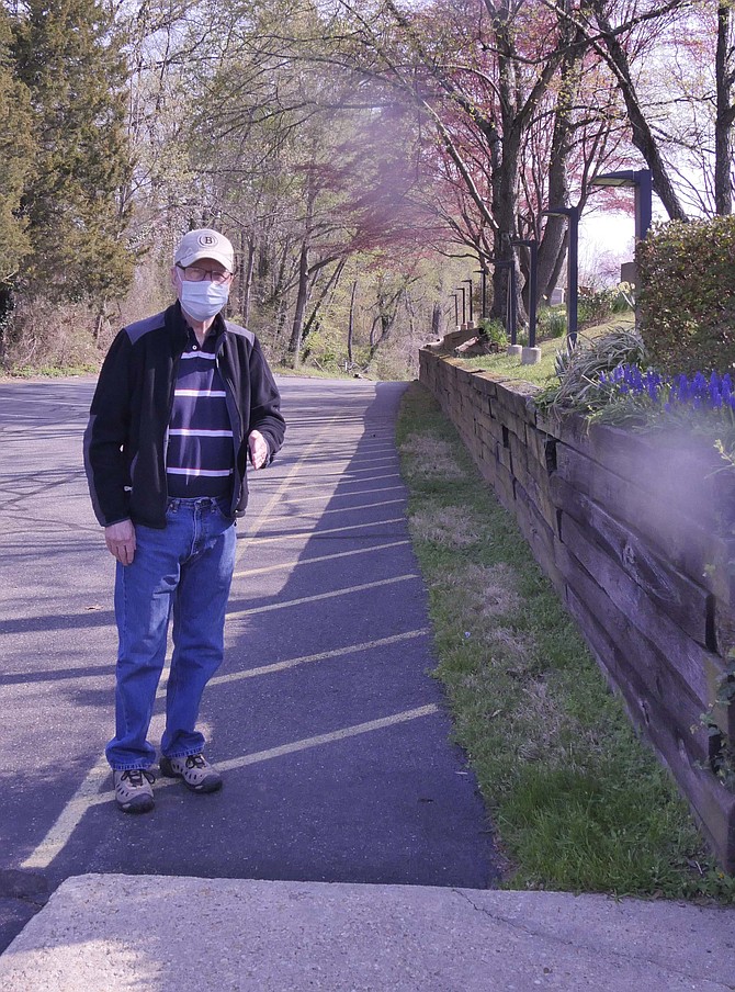 Larry Danforth shows where the new retaining will be built in the Walker Chapel United Methodist Church historic cemetery renovation.