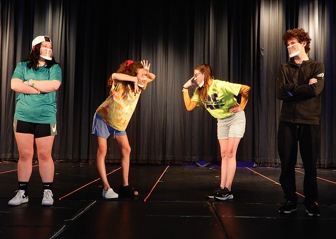 (From left) Playing children, Alex Lesnik and McKenzy Hopkins face off against their treasure-hunt competitors, Lucy Sherrier and Tristan Huber.