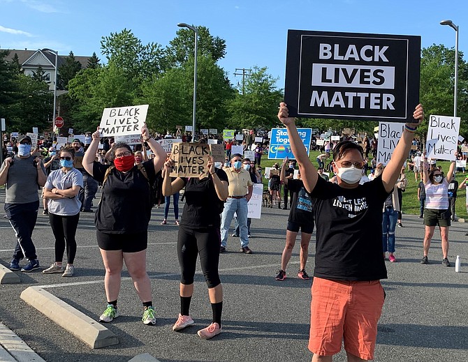 Crowds gather at Alexandria Police Headquarters June 2, 2020, to rally against racism and remember the lives of black Americans who have died while in police custody.