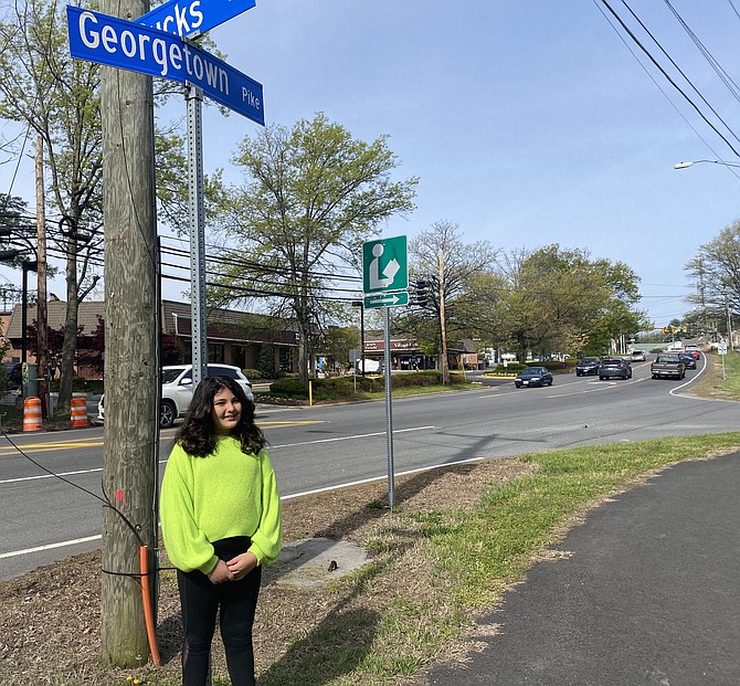 Ponteha Aryavand, 10, shows that other Pike areas have paved trails, such as the area in front of the Great Falls Library.