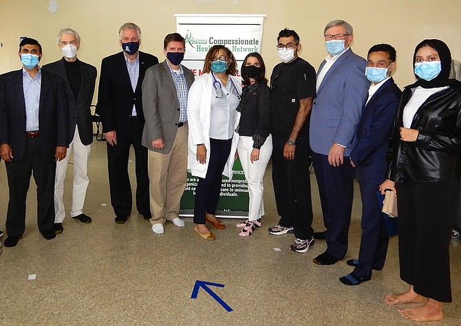 Inside the clinic are (from left) ADAMS President Syed Moktadir, ADAMS Board member Robert Marro, Gov. Terry McAuliffe, Supervisor Walter Alcorn, Dr. Annette Hall-Finney, State Sen. Jennifer Boysko (D-33), Dr. Sultan Chaudhry, Supervisor John Foust, ACHN Chairman Mahsin Habib and ADAMS member Faateha Syed.