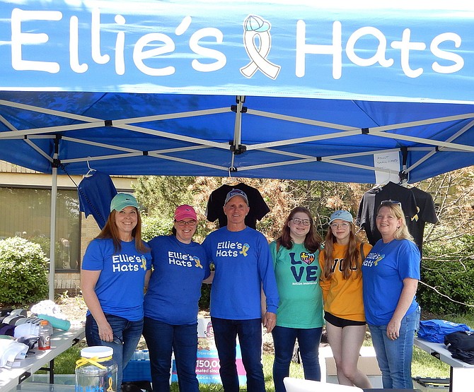 Manning the Ellie’s Hats booth are (from left) Beckie Reilly; Kim Luckabaugh; founder Jay Coakley; and Carrly, Jilli and Karen Russell.