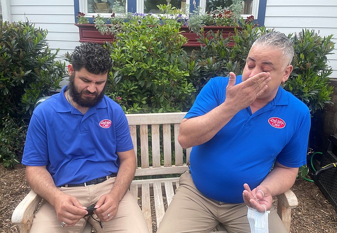 Del Ray Café manager Abdel Laassili, left, and employee Nadir Elijji get emotional May 7 as they talk about the significance of the month of Ramadan.