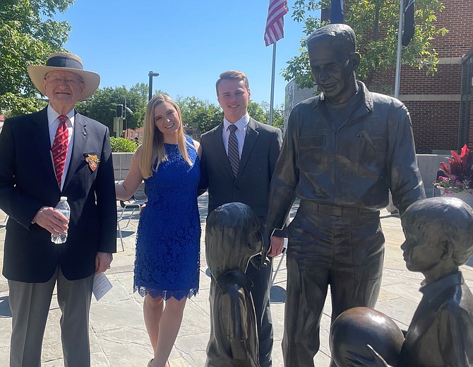 LTC Jack Bohman (ret), left, with Abigail Farley and Brett Pritchett commemorate Armed Forces Day May 15 at the Capt. Rocky Versace Plaza and Vietnam Veterans Memorial in Del Ray.