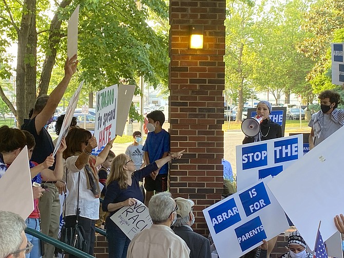 Demonstrators in support and those against Abrar Omeish, FCBS School Board Member At Large.