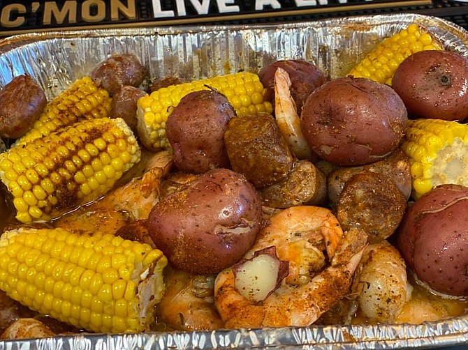A Cajun shrimp boil: Smoked Shrimp, andouille sausage, corn, and potatoes. From Hops n Shine.