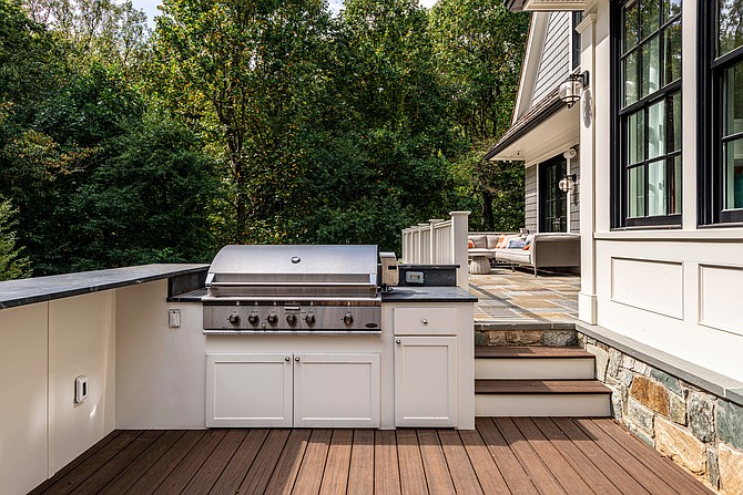 The outdoor deck kitchen of this McLean home, designed by GTM Architects.