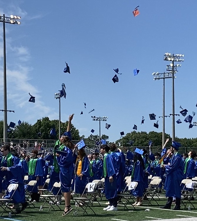 Officially announced graduates, the South Lakes High School Class of 2021 throws their caps in the air, symbolically ending a chapter in the graduates' lives.