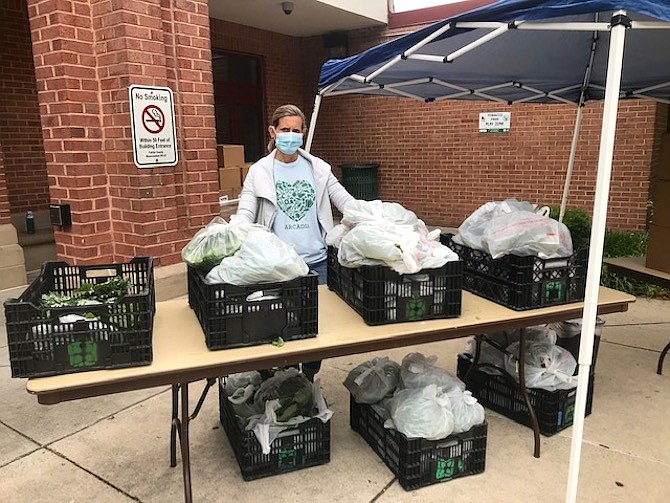 Arcadia is one of many organizations that coordinated the distribution of food boxes in the Route 1 Corridor during the pandemic. Here, Terri Siggins is distributing boxes of fresh produce at the Gum Springs Community Center.