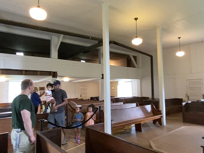 The inside of the Frying Pan Spring Meeting House on Centreville Road with one of the intact galleries where Black members of the congregation sat, segregated from the white members who sat on the main level.