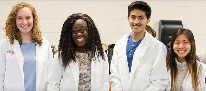 Students in their lab coats set to learn at Thomas Jefferson High School for Science and Technology.