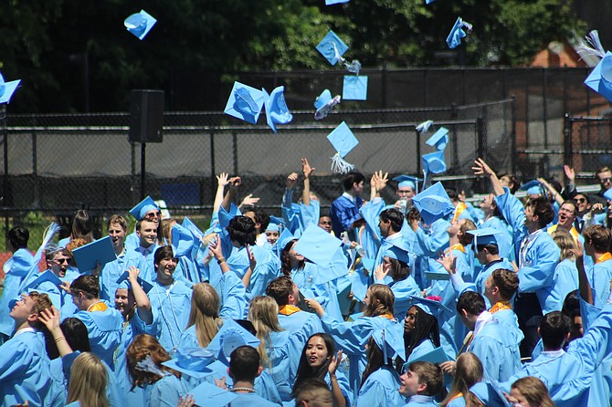 Graduates of Yorktown High School in Arlington tossed their mortarboards in celebration.