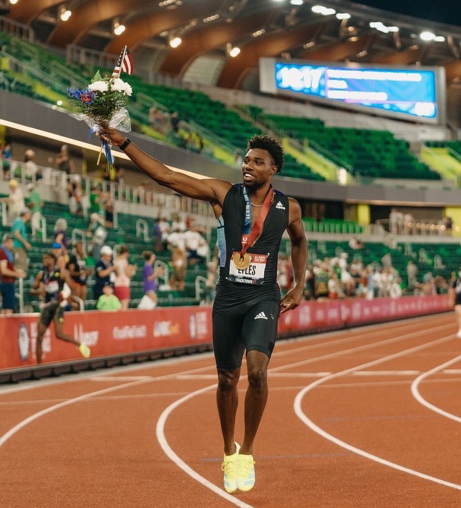 Alexandria native Noah Lyles celebrates after taking home the gold medal in the 200 meters during the U.S. Olympic Track & Field trials June 27 in Eugene, Ore. Lyles finished in 19.74 seconds — the fastest time in the world this year — and will compete this July at the Tokyo Olympics.