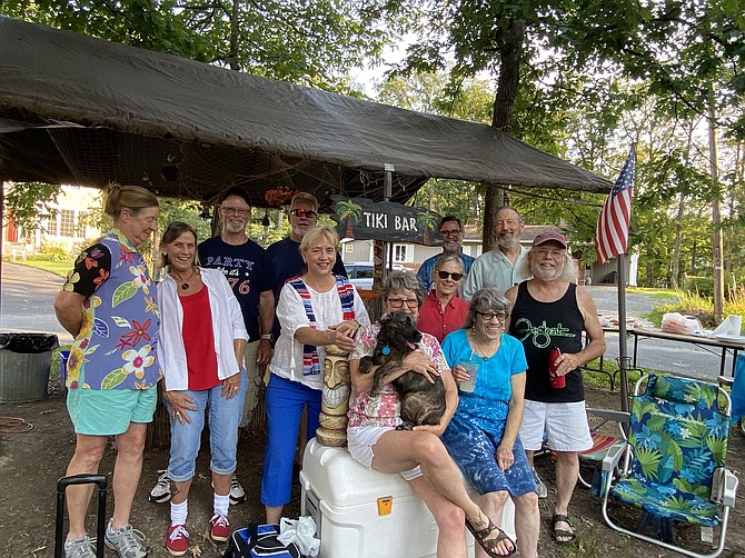 Neighbors and friends in the Town of Herndon gather in their Bower Lane cul-de-sac, lovingly called “the island,” to celebrate the 4th of July with a community picnic. Town Mayor Sheila Olem (second row, third from left) enjoys the festivities.