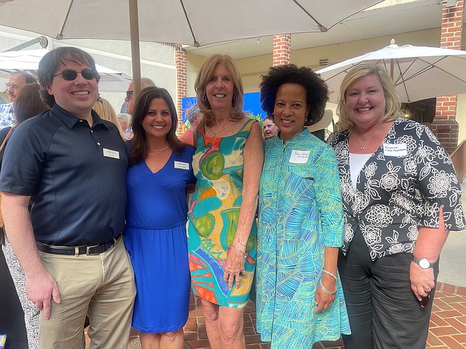 Lorraine Lloyd, center, celebrates her retirement from Visit Alexandria with co-workers Vita Fiore, Nancy Rosenbaum, Patricia Washington and Melanie Fallon June 23 at The Alexandrian Hotel.