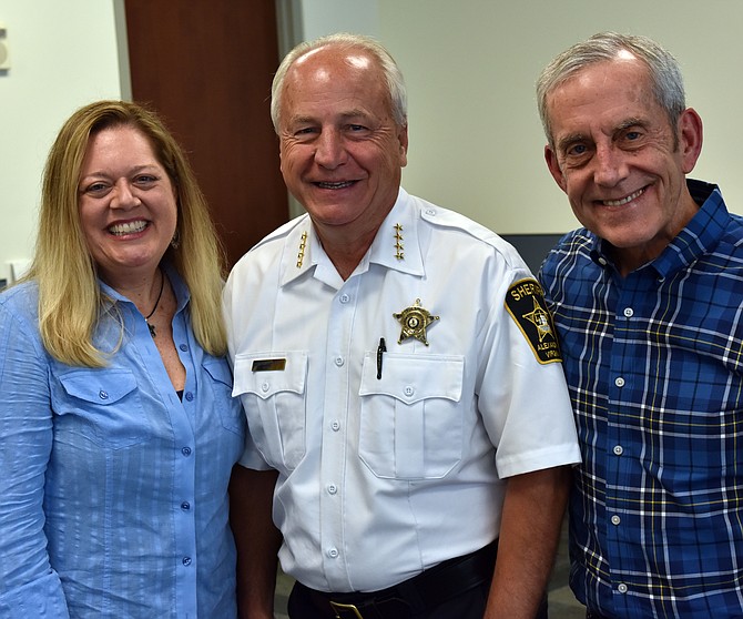 Sheriff Dana Lawhorne, center, with Police Chief Michael Brown and Brown’s wife Kirsten Knapp. Knapp recently retired from the Alexandria Sheriff’s Office.