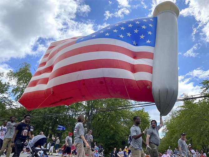 The Jubilee Christian Center guides the giant American Flag Balloon.