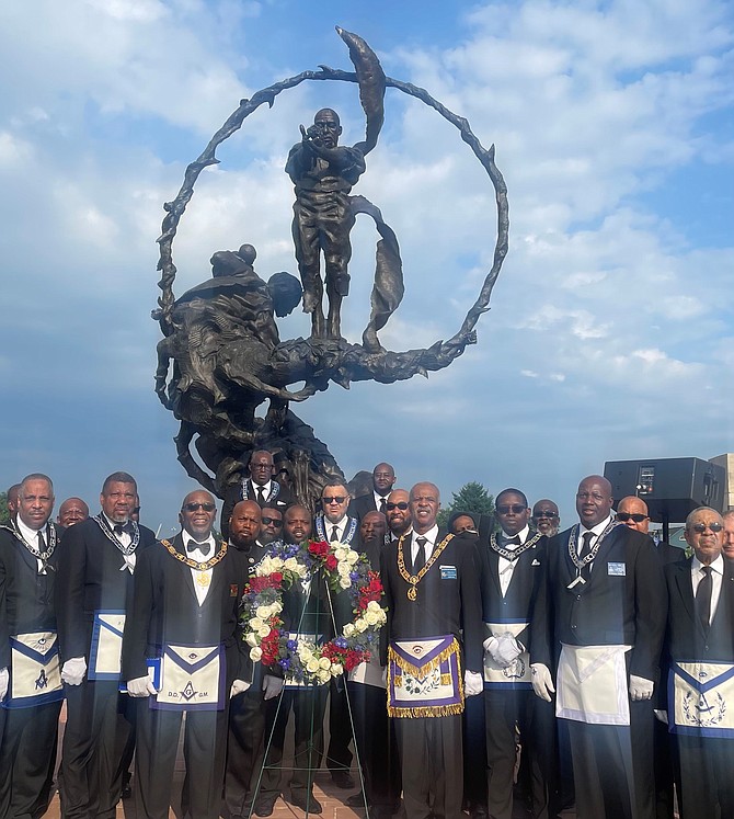 Members of the 31st Masonic District gather in front of the Contrabands and Freedmen Cemetery Memorial during the July 24 dedication of the site’s inclusion in the African American Civil Rights Network.