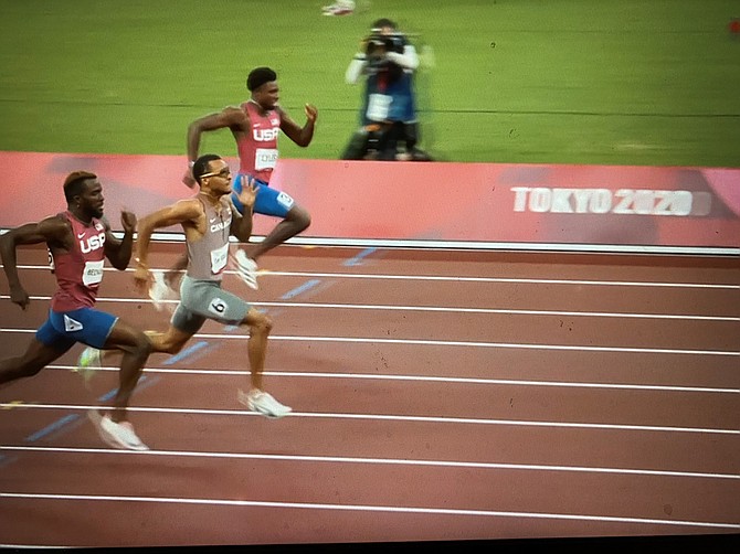 Canada’s Andre de Grasse, center, races for the gold medal ahead of Americans Kenneth Bednarek, left and Noah Lyles.