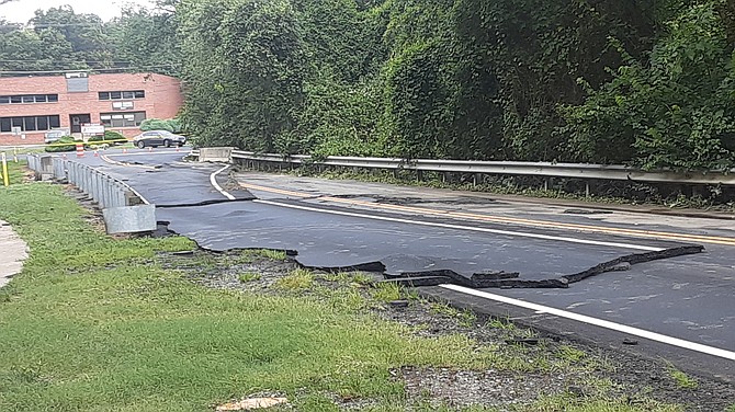 The pavement on Newington Road shifted from waters overflowing Long Branch.