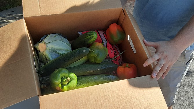 A box of vegetables is one part of the food distribution in Mount Vernon.