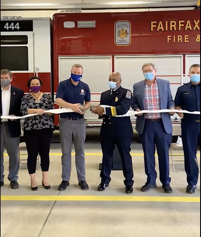 (From left) Fairfax County Supervisor Walter Alcorn (D-Hunter Mill), Supervisor Dalia A. Palchik (D-Providence District), Chairman Jeffry McKay (D-At-Large), Fire Chief John S. Butler, Supervisor John Foust (D-Dranesville), and  Captain Michael Greulich celebrate the ceremonial uncoupling of the hose, marking the official opening of the new Fairfax County Fire and Rescue Department, Fire and Rescue Station  No. 44, Scotts Run on Saturday, Saturday, Sept. 18, 2021.