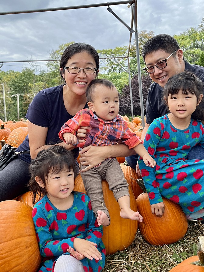 From left, Bella Pan, 3 of Vienna, mom, Jang, baby Jeremy, 9- months, Lexie, 5, and dad, Justin, enjoy their "family outing with the awesome weather," as Jang says. Asked if they will choose a pumpkin, Lexie says, "We're growing our own pumpkins."