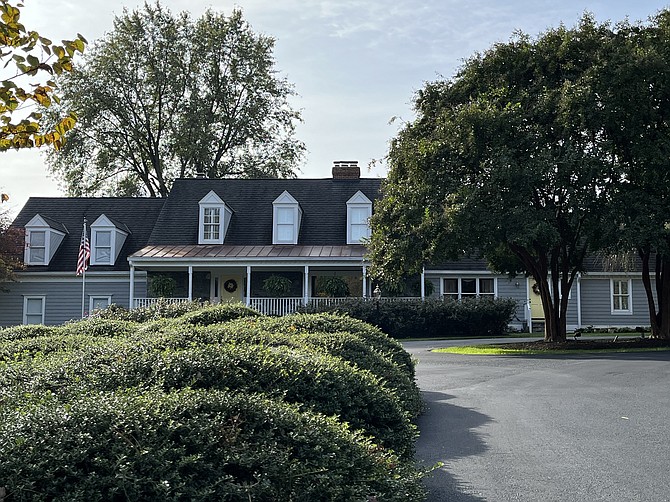 787 Stephanie Circle: Adaptive reuse saves an existing Cape Cod-style house and enlarges its living spaces with additions blending the structure into a new subdivision and upper scale residences.