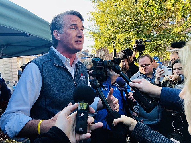 Glenn Youngkin speaks to reporters after a rally in Market Square.