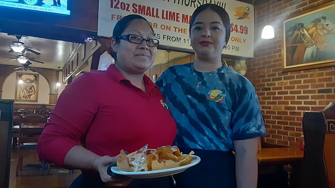 At El Paso, Carmen and Sandra with a plate of cheese nachos.